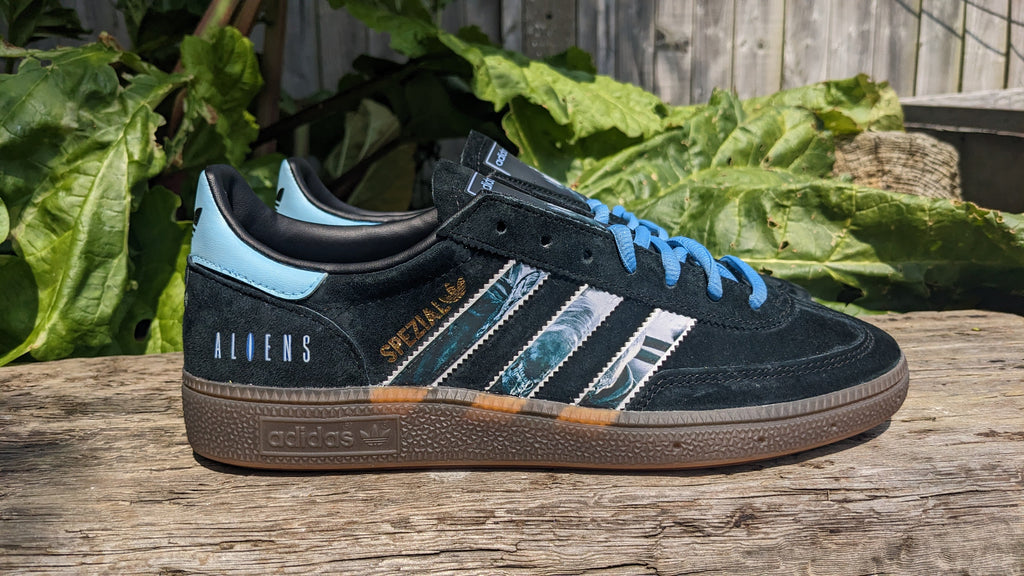 Limited edition Ridley Scotts Aliens inspired black / light blue Adidas Handball Spezial trainers / sneakers